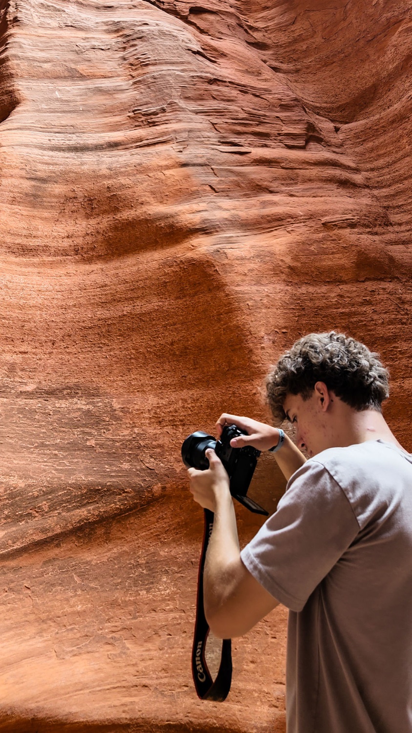 Behind the scenes — Noah shooting in a slot canyon
